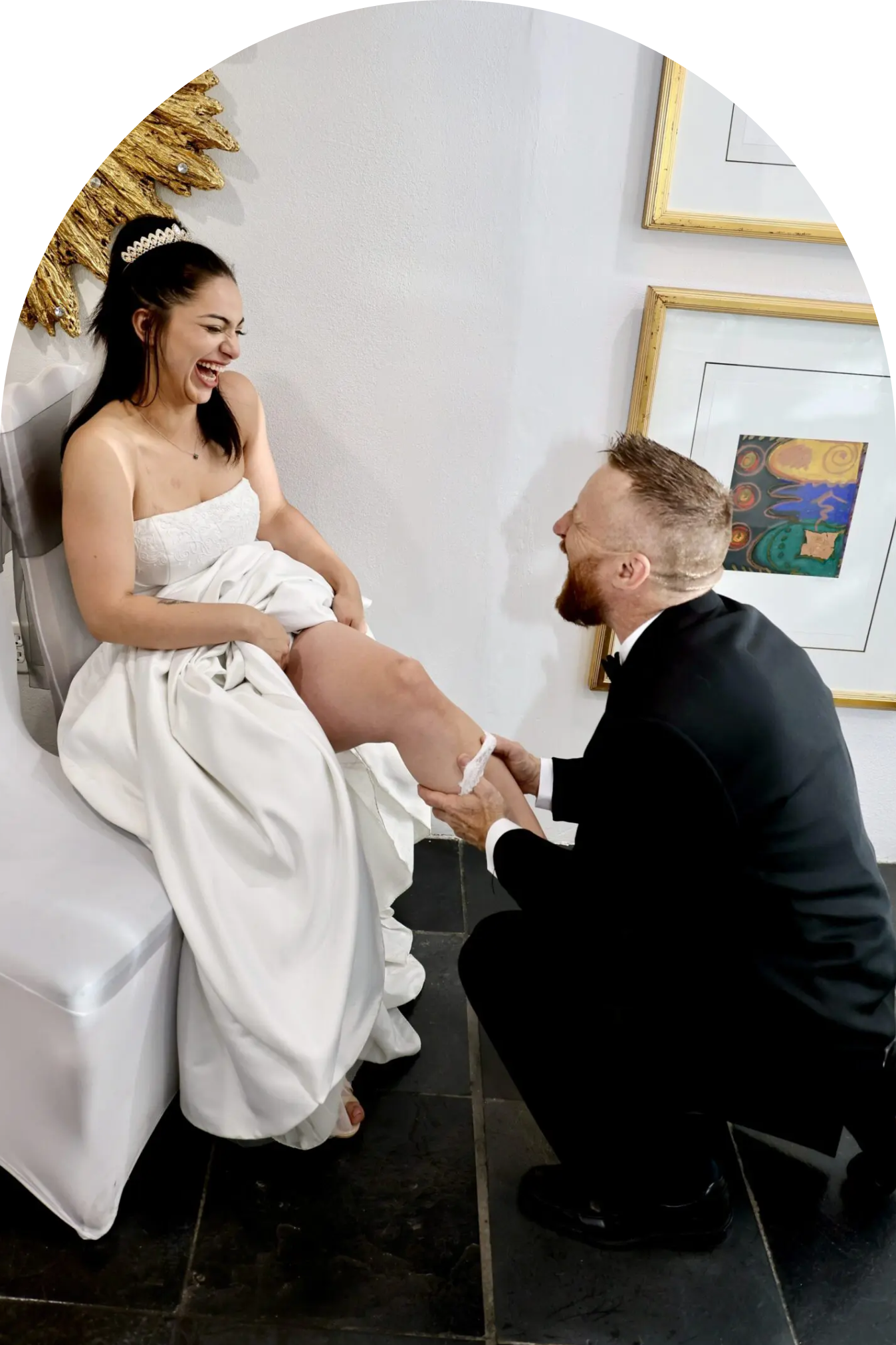 A man kneeling and holding a woman's hand, possibly proposing.